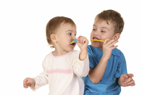 Baby and brother brushing